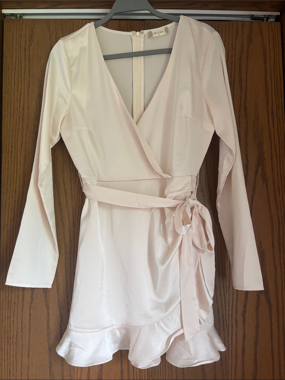 Light Pink Wrap Romper with Ruffle Hem